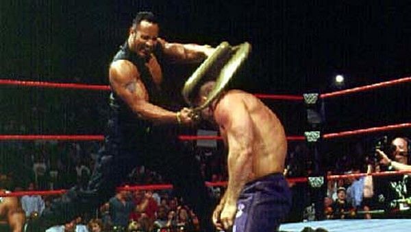 The Rock smashes Ken Shamrock with a chair